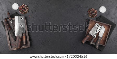Stock fotó: Vintage Meat Knife And Fork And Hatchets With Vintage Chopping Board And Black Table Background But