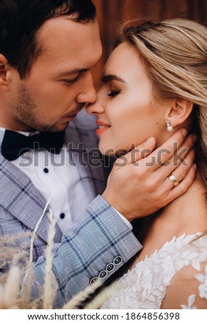 Foto stock: Close Up Portrait Of Handsome Attractive Male With Gentle Smile Stubble Wears Elegant Clothing Lo