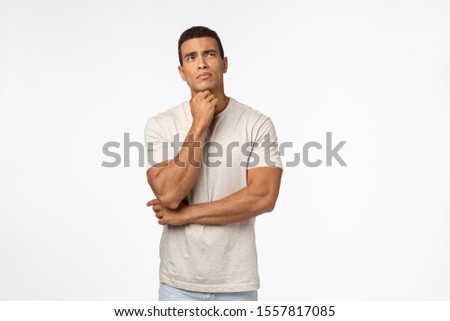 Stockfoto: Indecisive Young Thoughtful Male Athlete Trying Make Hard Choice Decide What Do Touching Chin Loo