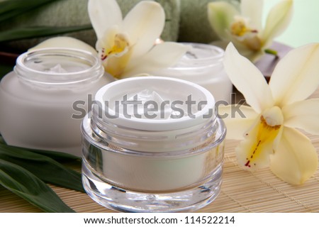 ストックフォト: Face Cream Moisturizer Jar And Orchid Flower Moisturizing Skin