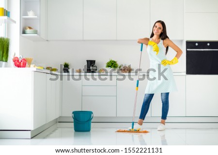 Stock fotó: Housekeeper Maid Wearing Rubber Gloves With Cloth Cleaning Or Ap