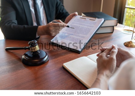 Foto stock: Male Notary Lawyer Or Judge Consult Or Discussing Contract Paper
