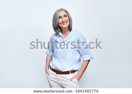 Stockfoto: Beautiful Businesswoman Looks Aside With Dreamy Expression Thinks About Something Pleasant During B