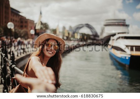 Imagine de stoc: Image Of Young Woman Reaching Hands At Camera While Walking Outd