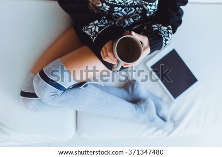 Stock fotó: Beautiful Woman At A Table With Latte Macchiato Reading Ebook