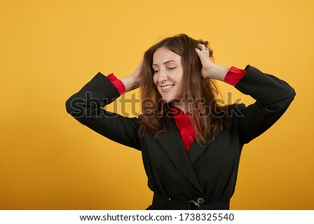 [[stock_photo]]: Good Looking Red Haired Female In Suit Relaxing With Her Laptop In The Kitchen In Her Appartment