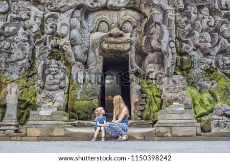 Foto d'archivio: Boy Tourist In Old Hindu Temple Of Goa Gajah Near Ubud On The Island Of Bali Indonesia Travel In B