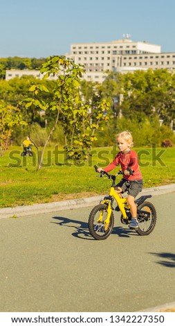 [[stock_photo]]: Two Happy Boys Cycling In The Park Vertical Format For Instagram Mobile Story Or Stories Size Mobil