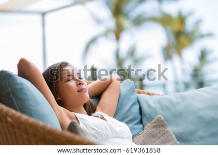 Home Lifestyle Woman Relaxing Sleeping On Sofa On Outdoor Patio Living Room Happy Lady Lying Down O Stockfoto © Maridav