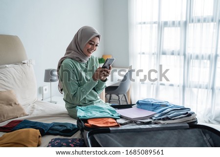 Stock foto: Young Asian Islam Woman Is Sitting Enjoy And Smiling When Working On Laptop On White Background