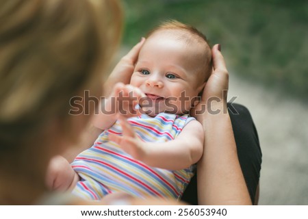 Stock photo: The Two Month Baby Looking At His Mother