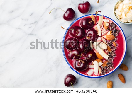 Stock fotó: Smoothie Bowl With Fresh Black Cherries Coconut Flakes Almond And Cocoa Nibs Top View Copy Space