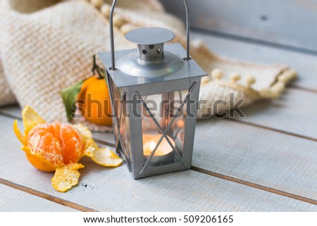 Foto stock: Christmas Lanterns Tangerine And Red Beads On White Wooden Back