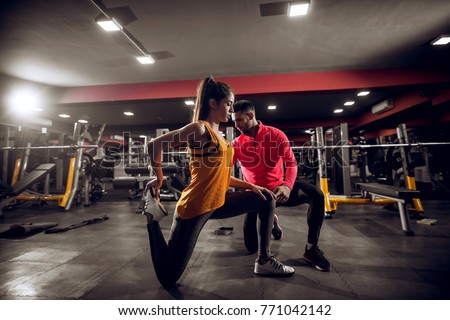 Stock fotó: Female Trainer Instructing Women While Exercising In The Boot Camp