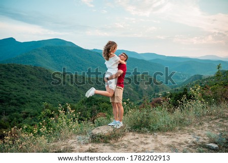 Stock photo: Couple In Love Walking In The Mountains Having Fun