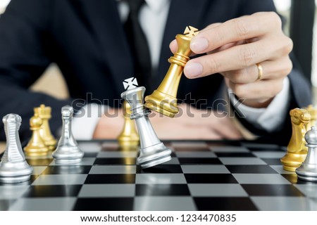 Stock foto: Businessman Playing Chess Figure Take A Checkmate Another King