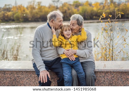 Stock foto: Senior Couple With Baby Grandson In The Autumn Park Great Grandmother Great Grandfather And Great