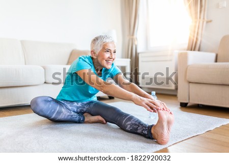 Senior Woman Stretching Her Body Yoga At Home Zdjęcia stock © Photoroyalty