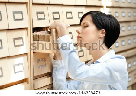 Сток-фото: Woman Searching At An Archive