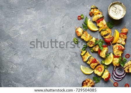 Zdjęcia stock: Grilled Pork And Chicken Kebab With Paprika On Stone Chopping Board With Salt Pepper And Tomatoes O