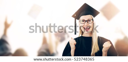 Foto stock: Graduation - Happy Graduate Wearing Gown And Hat With Copyspace