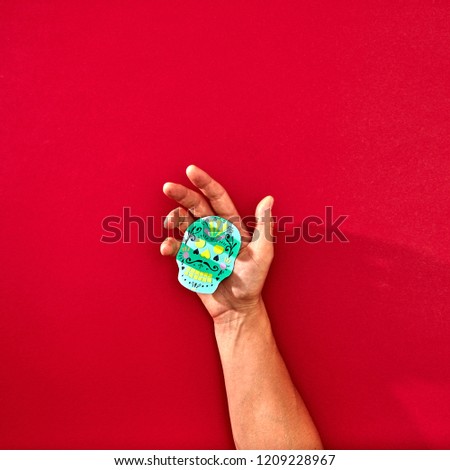 The Hand Of A Man Holds A Handcraf Paper Skull Calaveras Attributes Of The Mexican Holiday Calaca On Сток-фото © artjazz