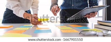 Stok fotoğraf: Business People Arranging Sticky Notes Commenting And Brainstorm