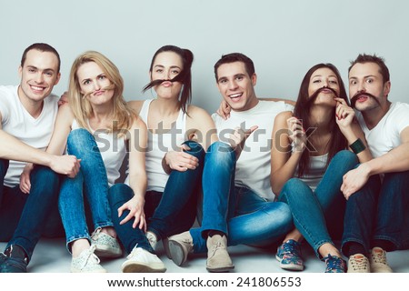 Young Girl Sitting With White T Shirt And Blue Jeans Over White Stock photo © Augustino