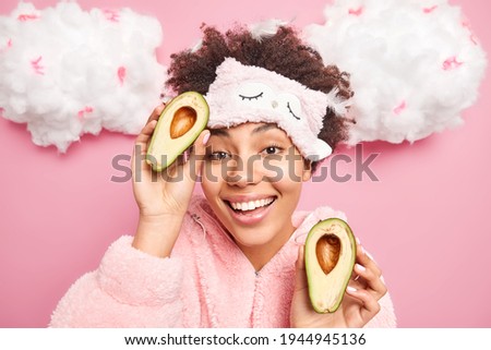 Stock fotó: Pretty Young Girl Wearing Pajamas Holding A Feather