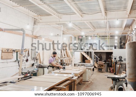 Foto stock: A Carpenter Working Hard At The Workshop