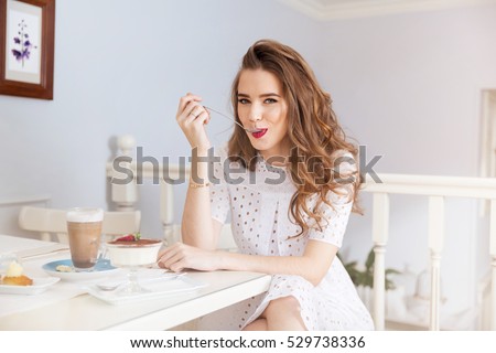 Stockfoto: Portrait Of Young Pretty Woman Eating Tasty Cakes On Valentines