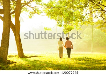 Mother And Daughter Walking In Park Foto d'archivio © szefei