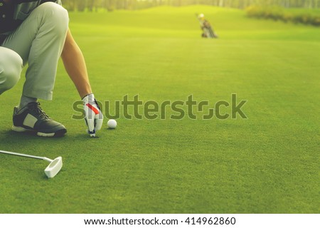 Stock photo: Golf Player Marking Ball On The Putting Green