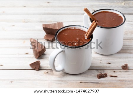 Stock photo: Two Cups Of Hot Coffee Or A Cappuccino With Christmas Decorations