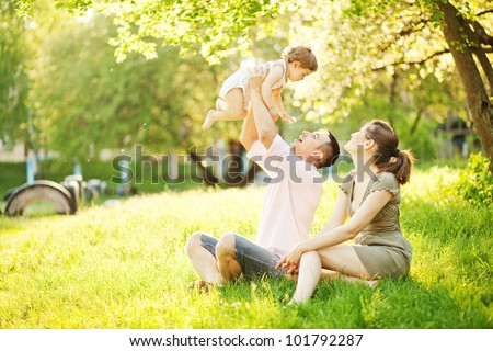 [[stock_photo]]: Happy Young Family Spending Time Outdoor On A Summer Day Picnic