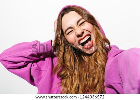 [[stock_photo]]: Portrait Of Ecstatic Woman 20s Wearing Sweatshirt Laughing While