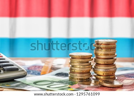 Stockfoto: Euro Banknotes And Coins In Front Of The National Flag Of Slovak
