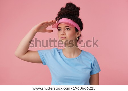 Stock photo: Photo Of Attractive Woman With Curly Hair Has Blue Eyes Dressed In Leather Black Jacket Keeps Han