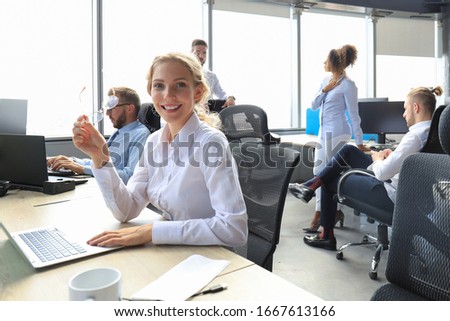 Foto stock: Smiling Business Women In Focus With Two Business Collegue Welcoming Each Other