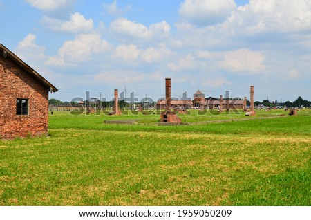 Stok fotoğraf: Wire Fence And Barracks In Auschwitz - Birkenau Concentration Ca