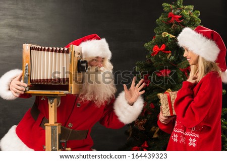 Stock fotó: Photo Of Santa Claus With His Wife Surprising And Opening Christ