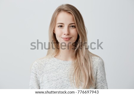 Stock photo: Smiling Cute Young Girl Facing Camera