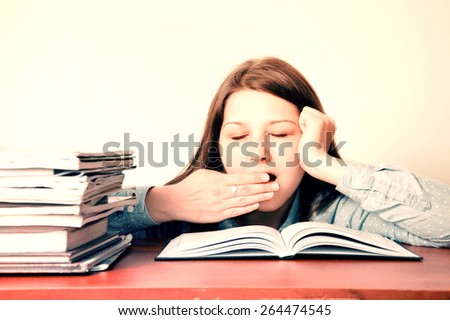 Stok fotoğraf: Young Beautiful Girl Yawning During Class