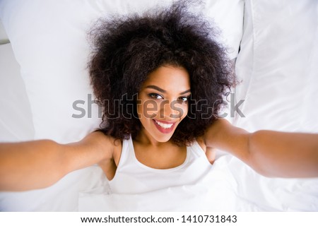 [[stock_photo]]: Top View Of Beautiful Lying Woman Taking Selfie With Smartphone