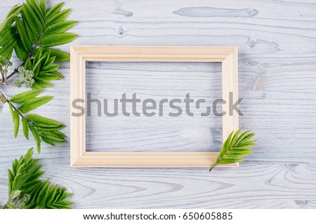 Stock fotó: Young Green Leaves On Light Blue Wooden Board Decorative Spring Background With Copy Space Top Vie