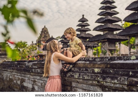 Stok fotoğraf: Mom And Son Tourists In Traditional Balinese Hindu Temple Taman Ayun In Mengwi Bali Indonesia Trav