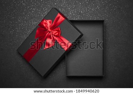 Stock fotó: Open Black Empty Gift Box With Red Bow And Ribbon On Dark Background Top View Template For Your Pr