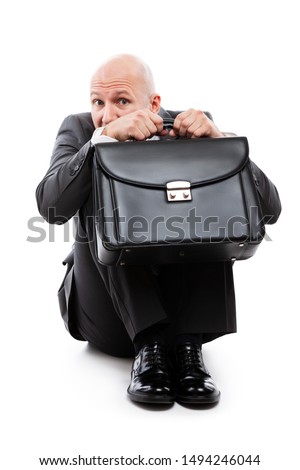 Foto stock: Unhappy Scared Or Terrified Businessman In Depression Hand Holding Briefcase