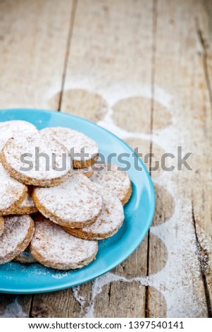 Foto stock: Fresh Baked Oat Cookies With Sugar Powderon Blue Ceramic Plate C