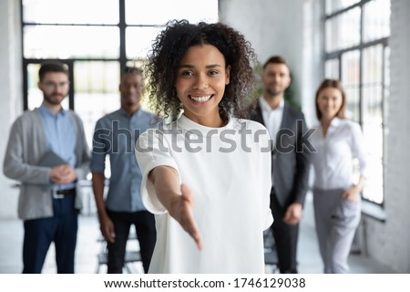 [[stock_photo]]: Confident Mixed Race Businesswoman Gesturing With Hand To The Si